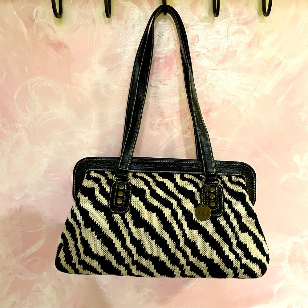 The Sak knit zebra shoulder bag 🦓 with snap closure 👛 and croc 🐊 leather